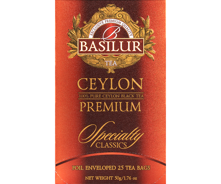Basilur Ceylon Premium - czarna herbata cejlońska w ozdobnej, pomarańczowej kopercie.