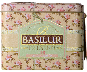 Basilur Present Pink - zielona herbata cejlońska z dodatkiem pąków jaśminu, ananasa, owoców dzikiej róży, mango oraz aromatu truskawki. Zdobiona puszka przypominająca szkatułkę.