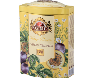 Basilur Passion Tropica - zielona, liściasta herbata cejlońska z rumiankiem i aromatem marakui. Ozdobna, żółta puszka z botanicznym motywem i logo Basilur.