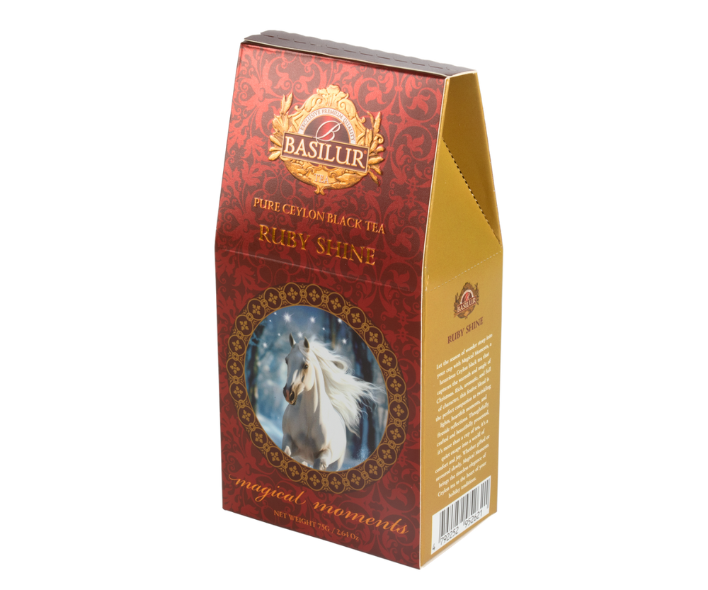 Herbata Basilur Ruby Shine w bordowym pudełku z motywem białego konia w zimowej scenerii.