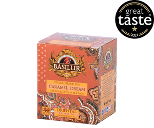 Basilur Caramel Dream - czarna herbata cejlońska z naturalnym aromatem karmelu w ekspresowych torebkach w kopertach. Ozdobne, pomarańczowe pudełko z orientalnym motywem.