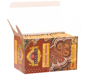 Basilur Caramel Dream - czarna herbata cejlońska z naturalnym aromatem karmelu w torebkach ekspresowych w kopertach. Pomarańczowe, ozdobne pudełko z orientalnym motywem.