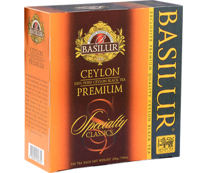 Basilur Ceylon Premium - czarna herbata cejlońska skomponowana z liści BOPF bez dodatków. Ozdobne opakowanie z pomarańczowymi elelmentami.