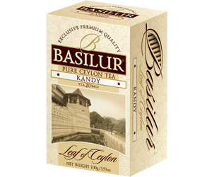 Basilur Kandy - cejlońska herbata czarna ekspresowa bez dodatków. Żółte, ozdobne pudełko ze zdjęciem miasta.