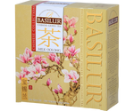Basilur Milk Oolong - zielona herbata cejlońska oraz zielona herbata oolong z dodatkiem aromatu mleka. Kremowe pudełko z motywem magnolii.
