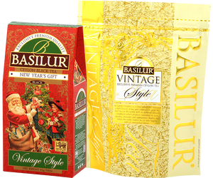 Basilur New Year's Gift - czarna herbata cejlońska z dodatkiem wiśni, krokosza barwierskiego oraz aromatu wiśni i słodkich migdałów. Czerwone pudełko ze świątecznym motywem.