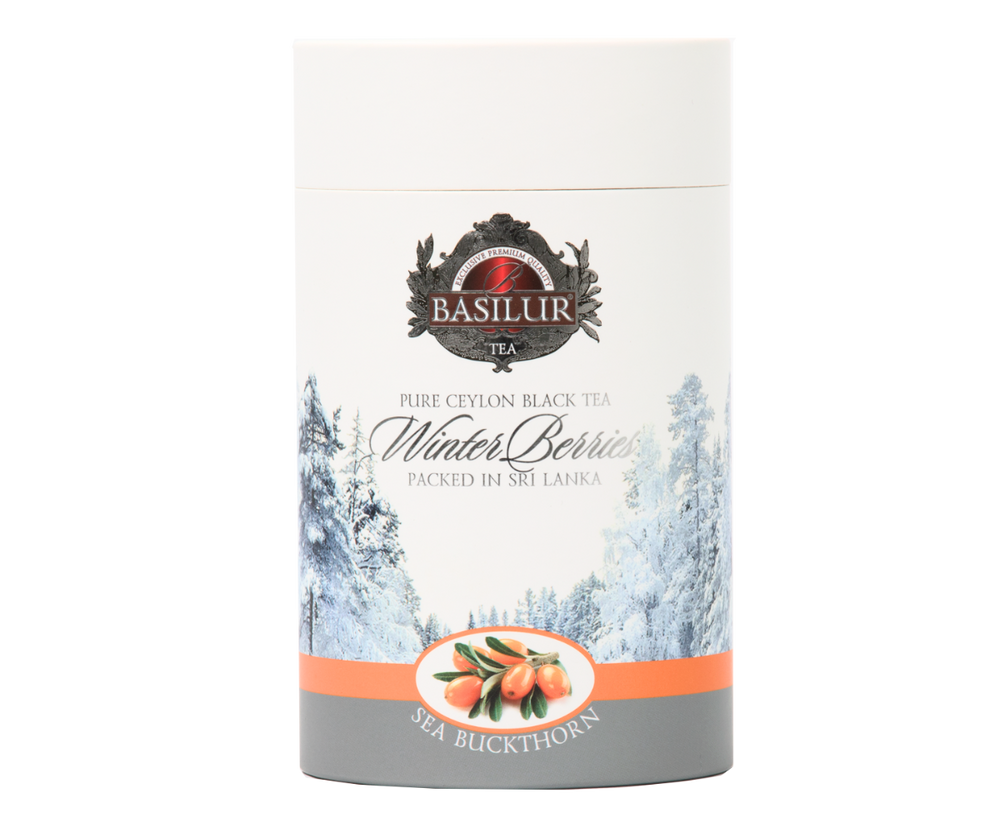 Herbata zimowa z rokitnikiem Basilur Sea Buckthorn w papierowej tubie z zimowym pejzażem.